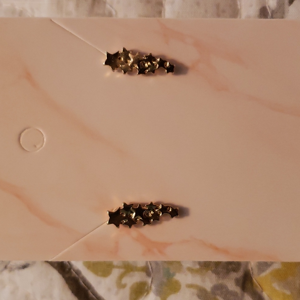 Gold shooting stars earrings